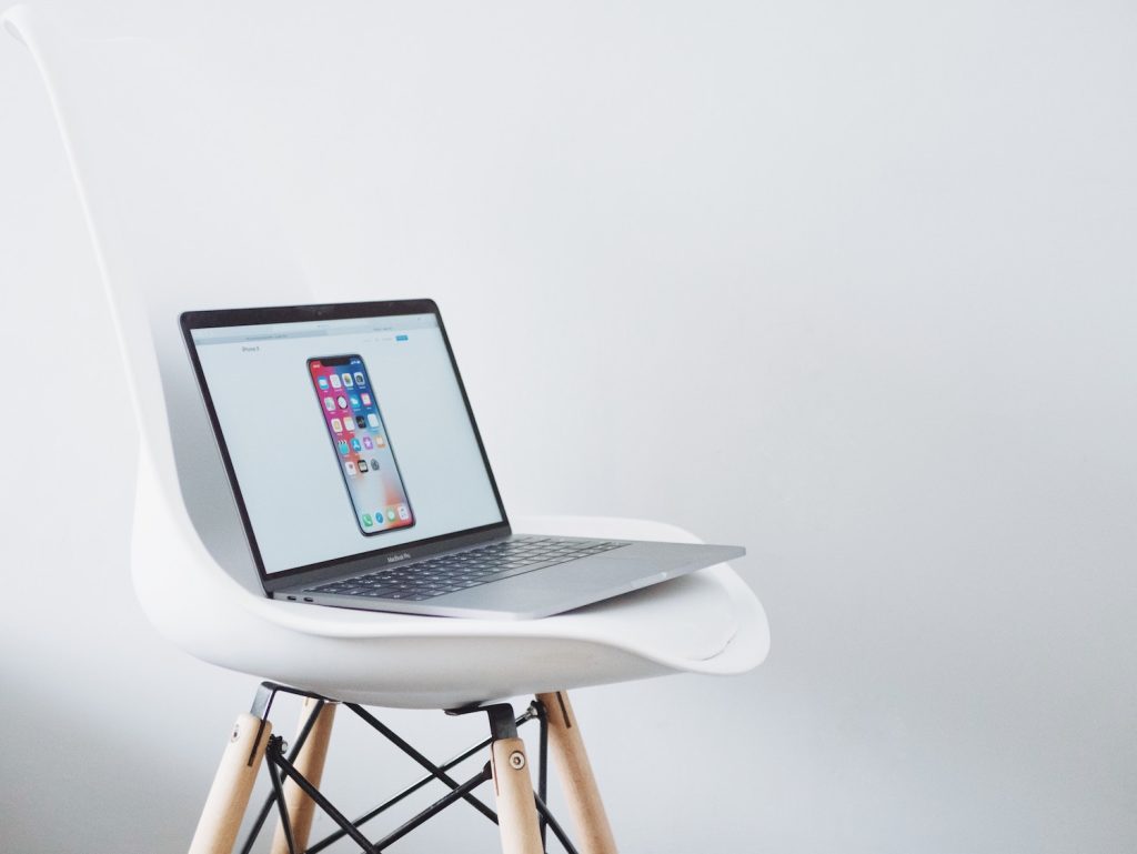 Laptop on white chair